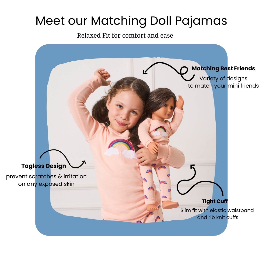 matching girl and doll pajamas, girl and doll wearing retro rainbow pajamas in light pink