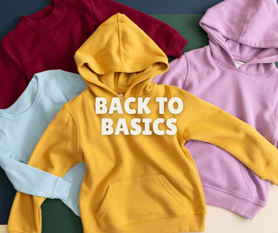 Yellow hoodie with 'BACK TO BASICS' text on a colorful background

