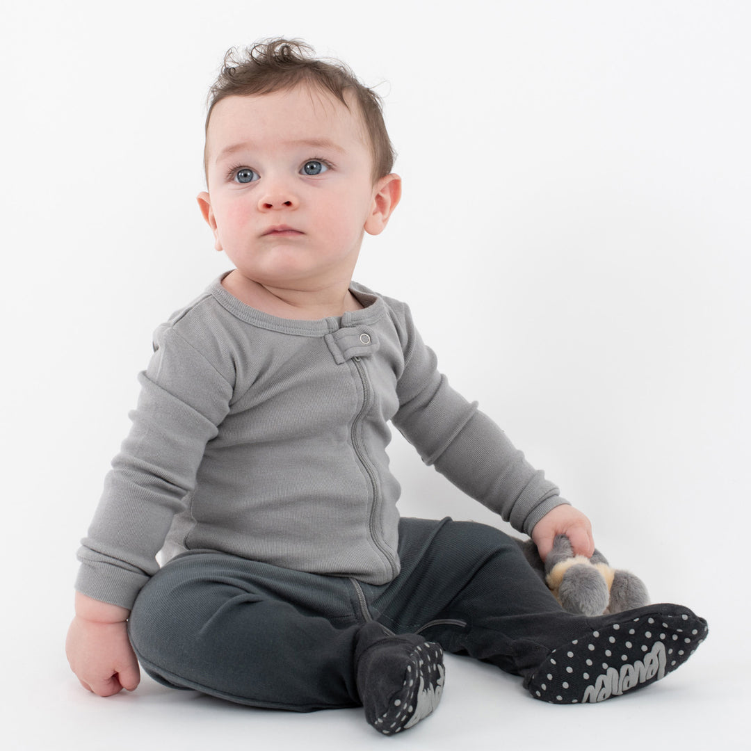 Baby in a grey ombre footie pajama