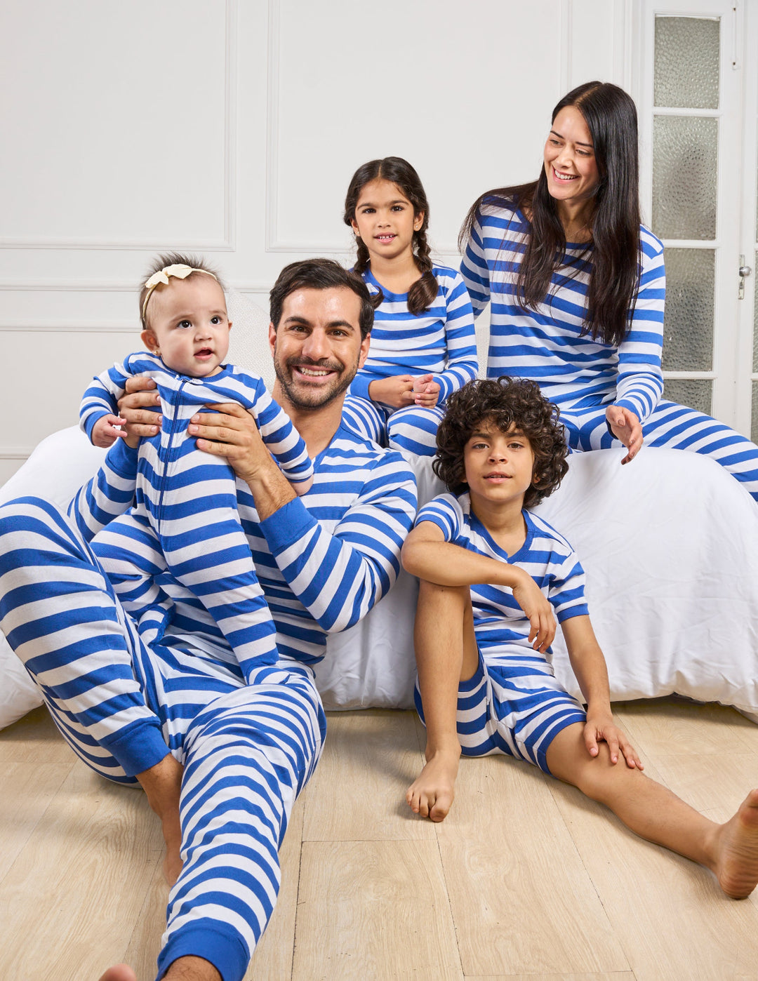 matching family pajamas in blue and white stripes