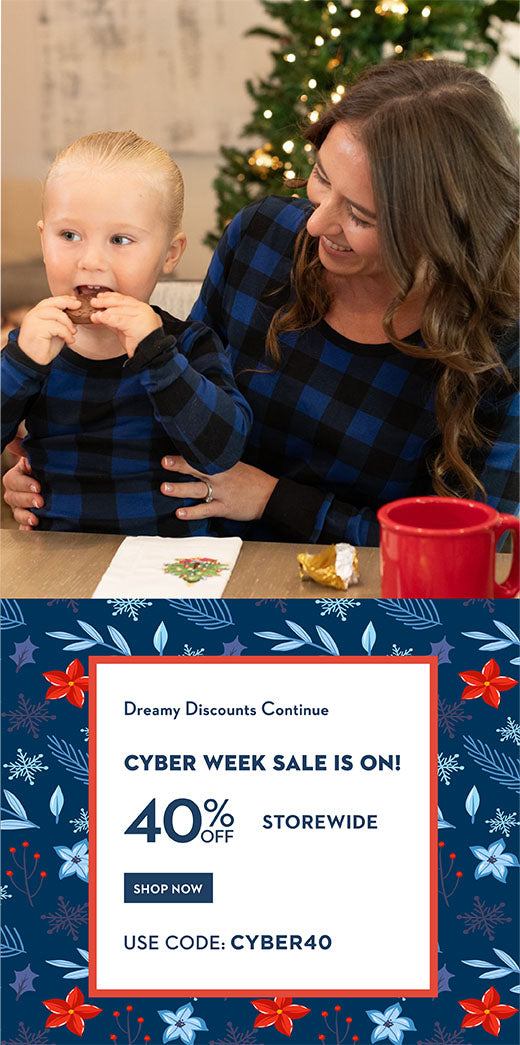 Cyber Week Sale! 40% off storewide, use code cyber40. Mom and son wearing black and navy plaid pajamas