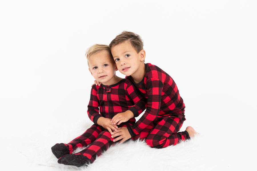 two boys in red and black plaid pajamas