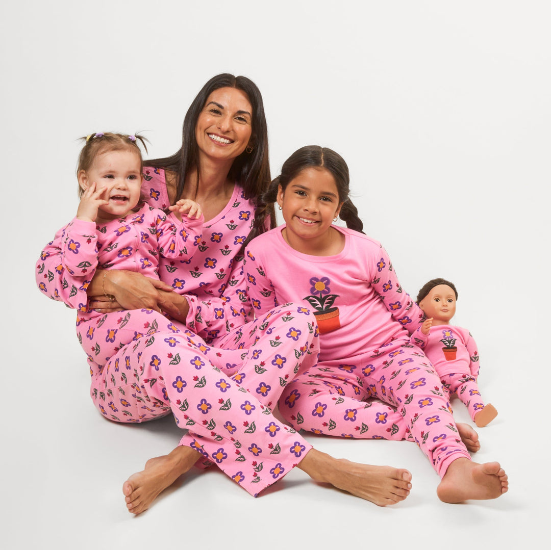 mom with two daughters in matching pajamas