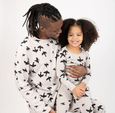 Dad and daughter in matching bird pajamas