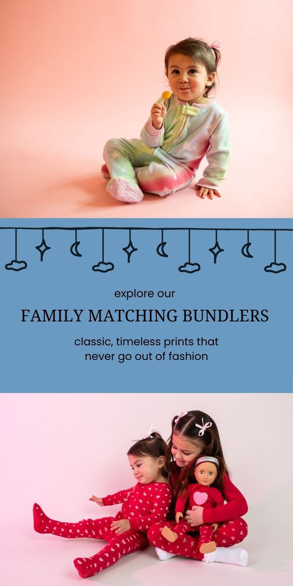 explore our family matching bundlers, sisters wearing red and pink heart pajamas, baby wearing fleece footed pajamas with tie dye unicorn