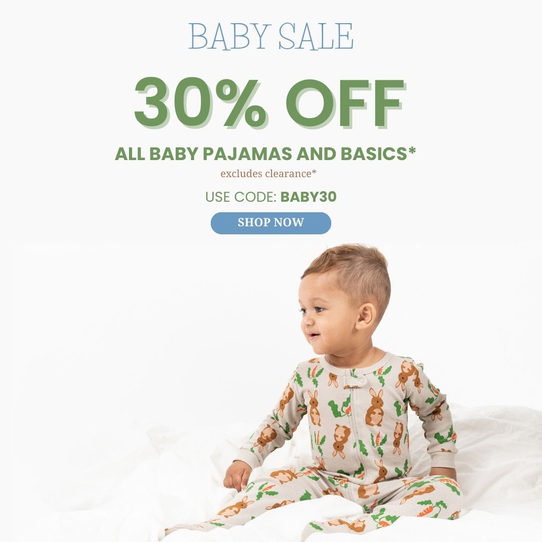 Baby sale:30% off all baby/footed pajamas and basics use code Baby30, Baby wearing beige rabbit footed pajama