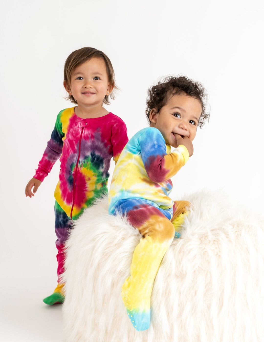 swirl tie dye footed baby pajamas on babies