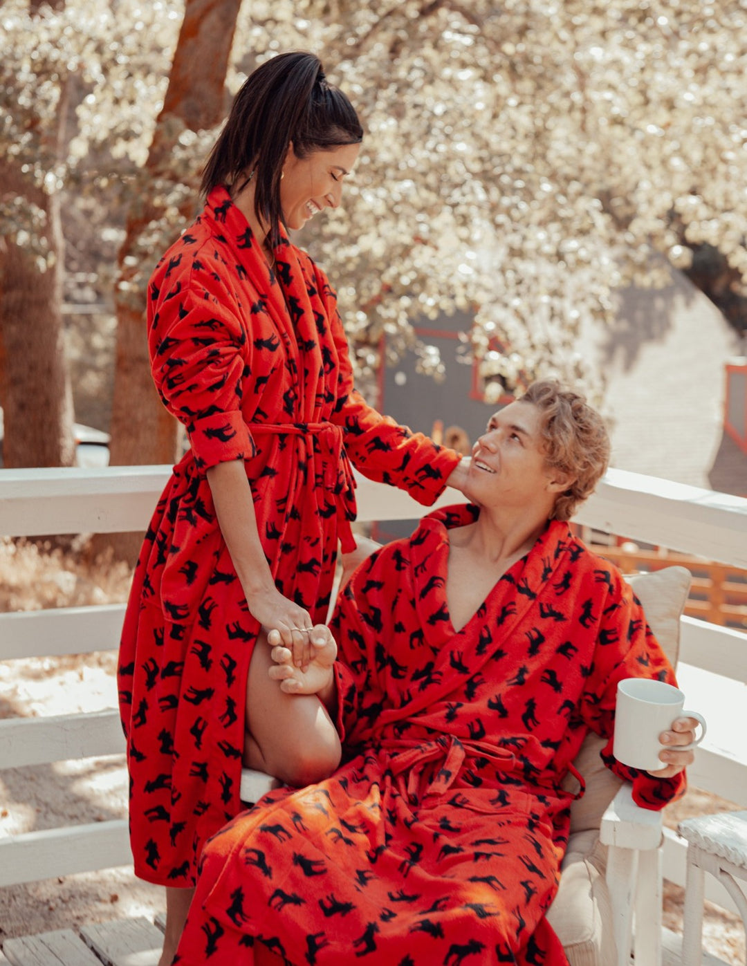 A couple wearing Soft Micro Fleece Bathrobes while outside